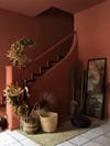 terra cotta colored entryway with staircase