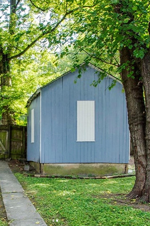 Before: blue wooden garage