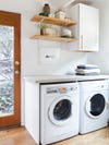laundry machines with open wood shelves