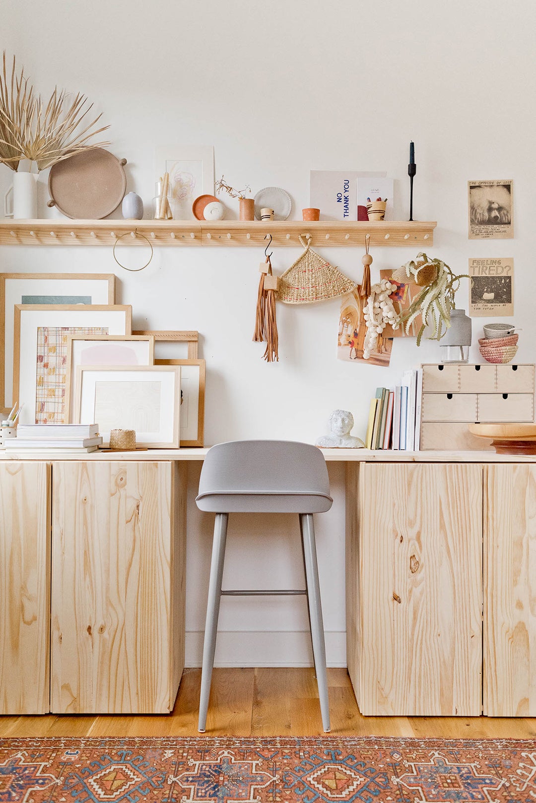 plain wood desk with tan stool