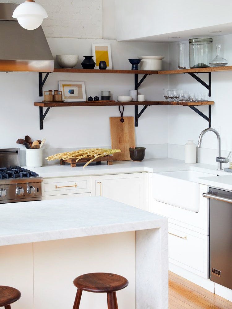 white kitchen with wood open shelves