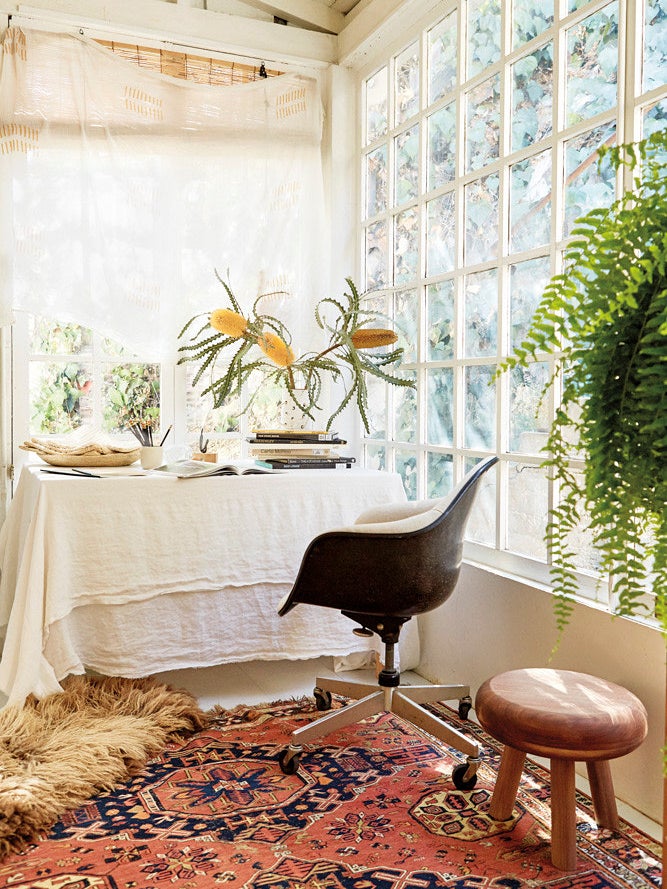 Sun room with tablecloth on desk