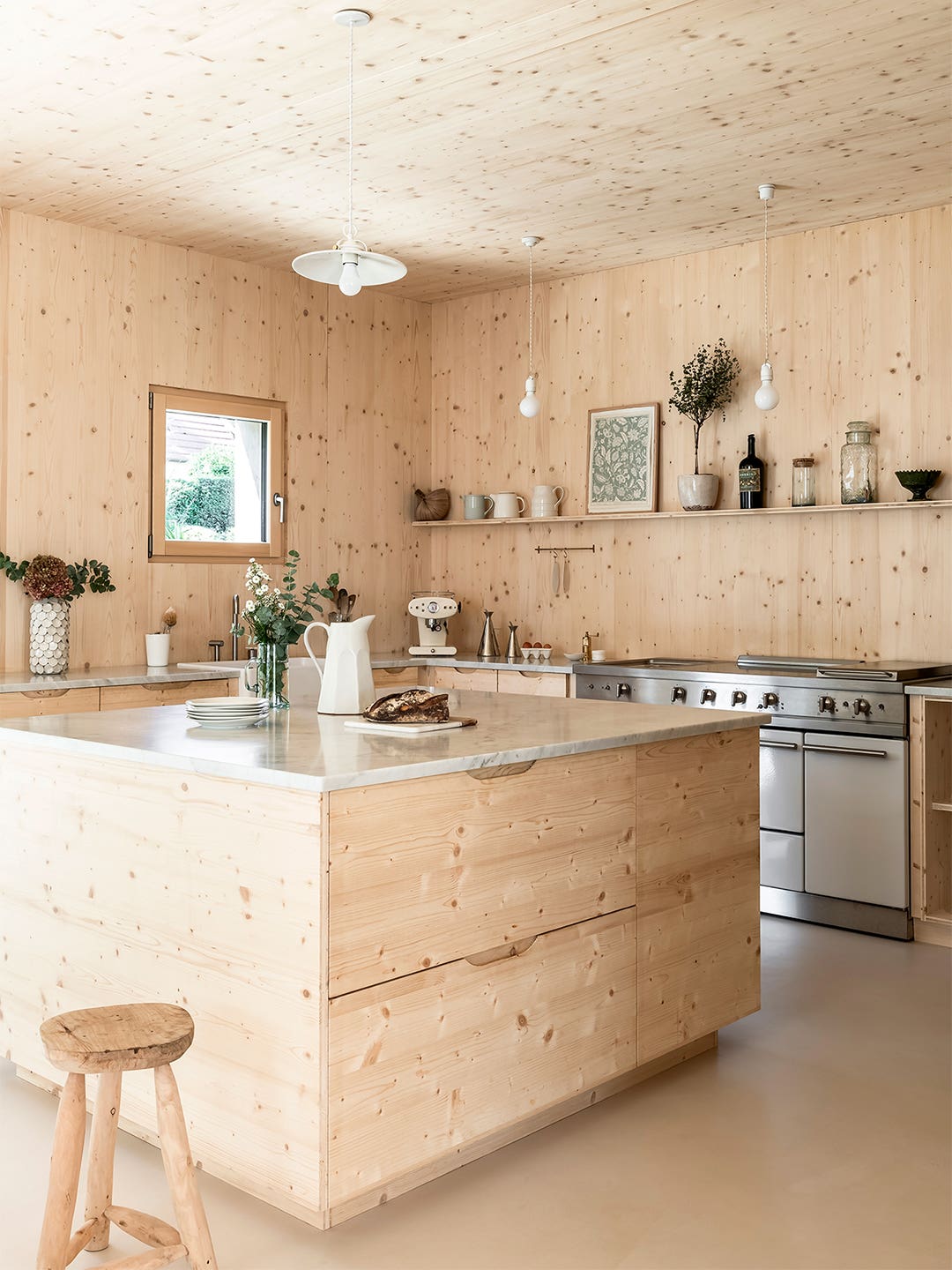 wood kitchen with cream resin floors