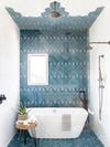 Bathroom with tub and blue tile