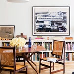 dining room with long bookshelf