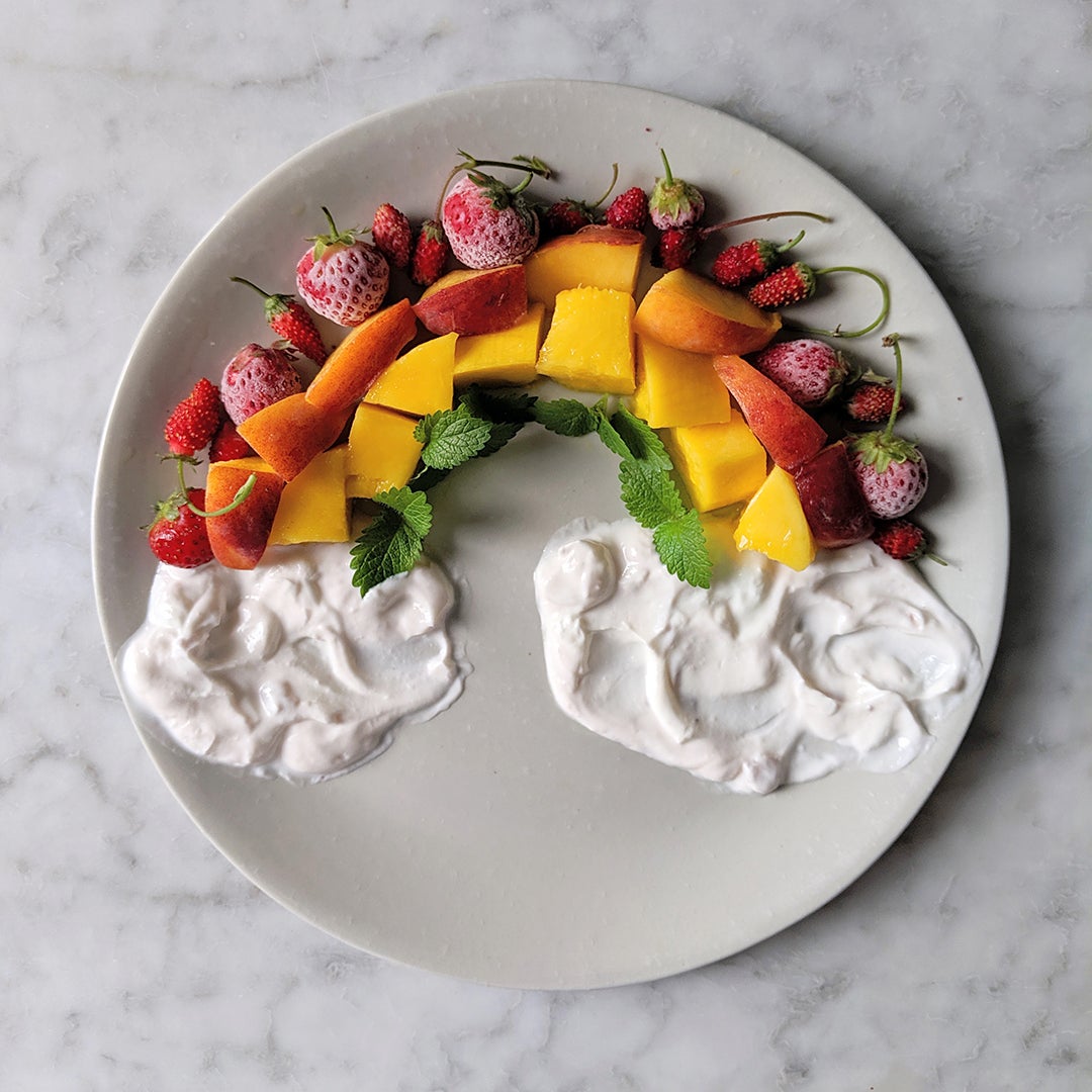 fruit rainbow with yogurt on a plate