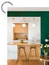 green and white kitchen with pendant lights over island