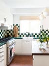 Green and white tiled kitchen