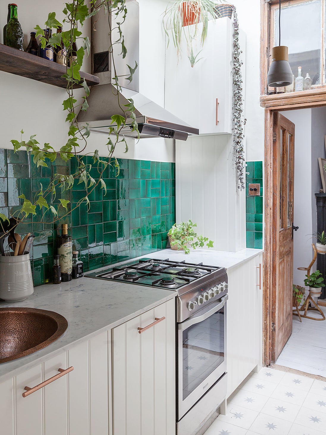 galley kitchen with verdant green tiles