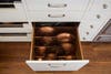 copper pan lids in drawer
