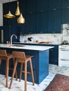 gold pendants in a blue kitchen