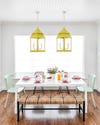 colorful breakfast nook with yellow pendant lights