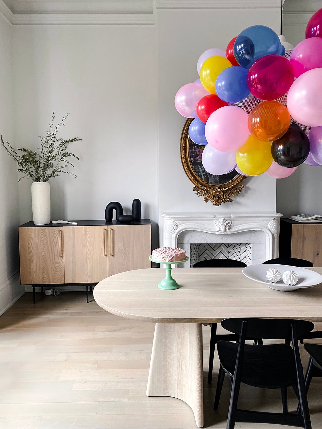 dining table with balloons over it
