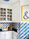 blue and white kitchen with & sign