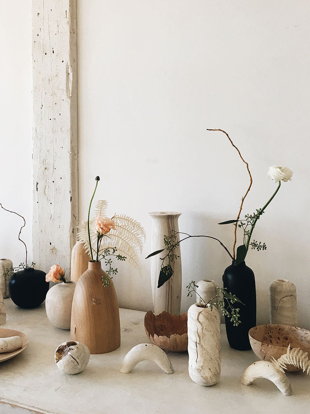 vases and other sculptural objects on a table