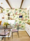 yellow tropical wallpaper in kitchen with dining nook