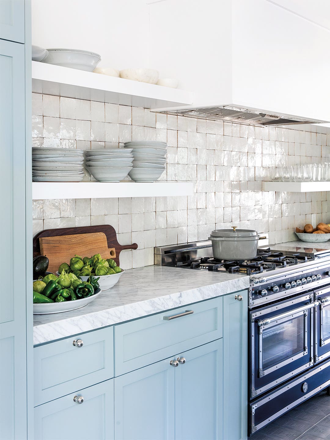 light blue kitchen cabinets with zellige tile backsplash