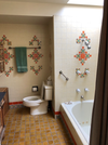 old bathroom with orange tiles