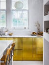 Kitchen with brass cabinets