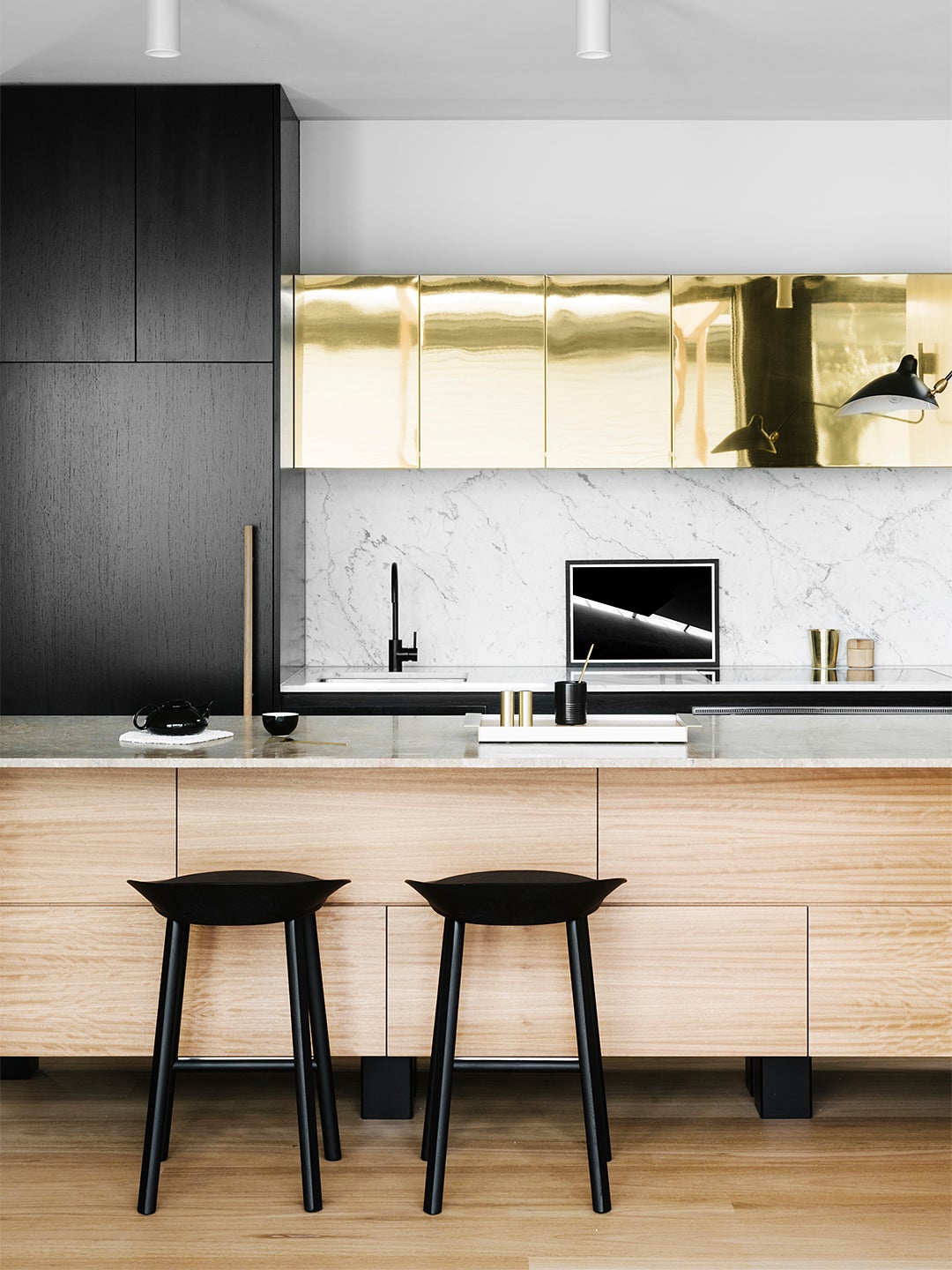 Kitchen with shiny brass upper cabinets