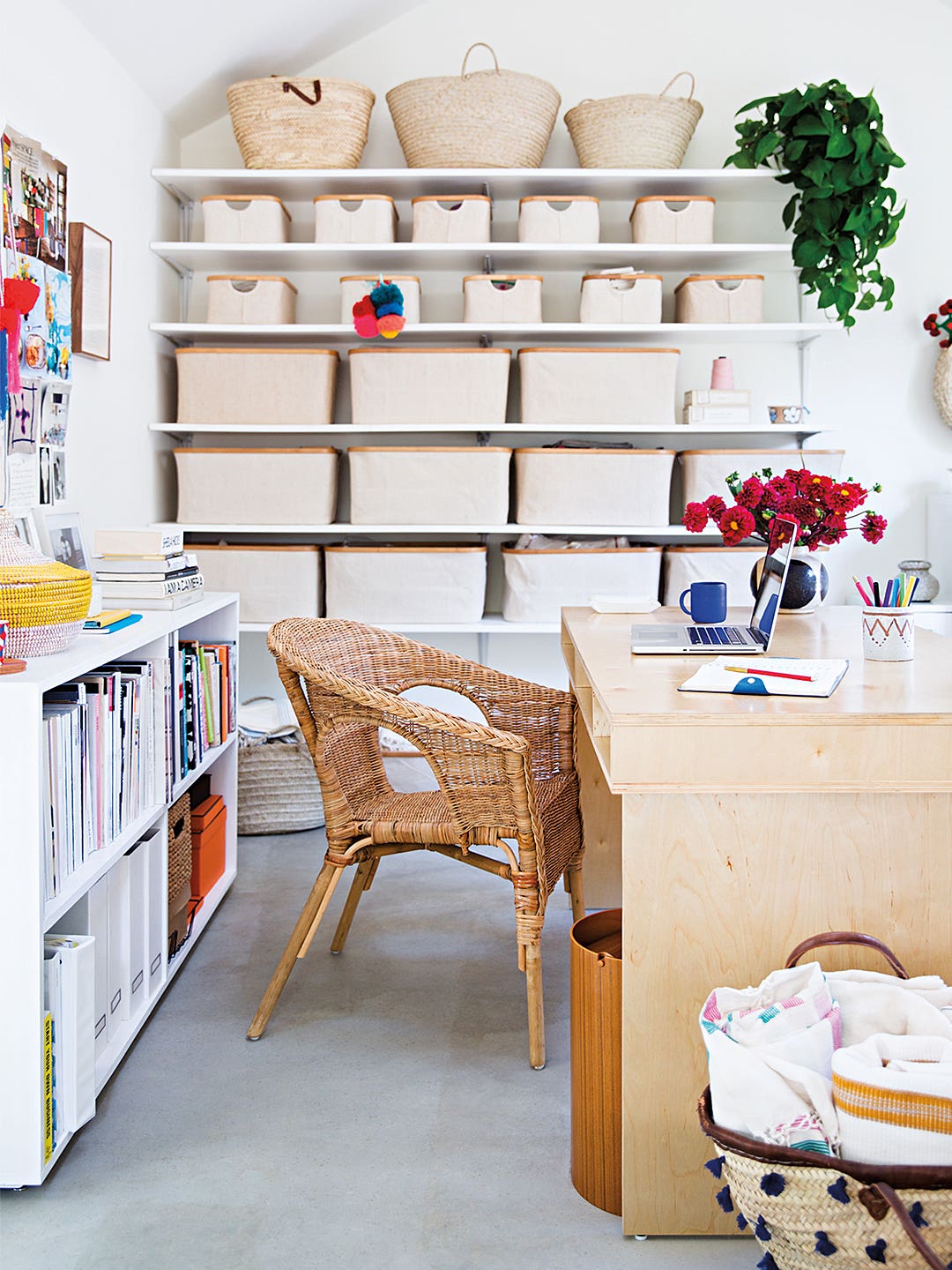 workspace with wooden desk and craft shelves