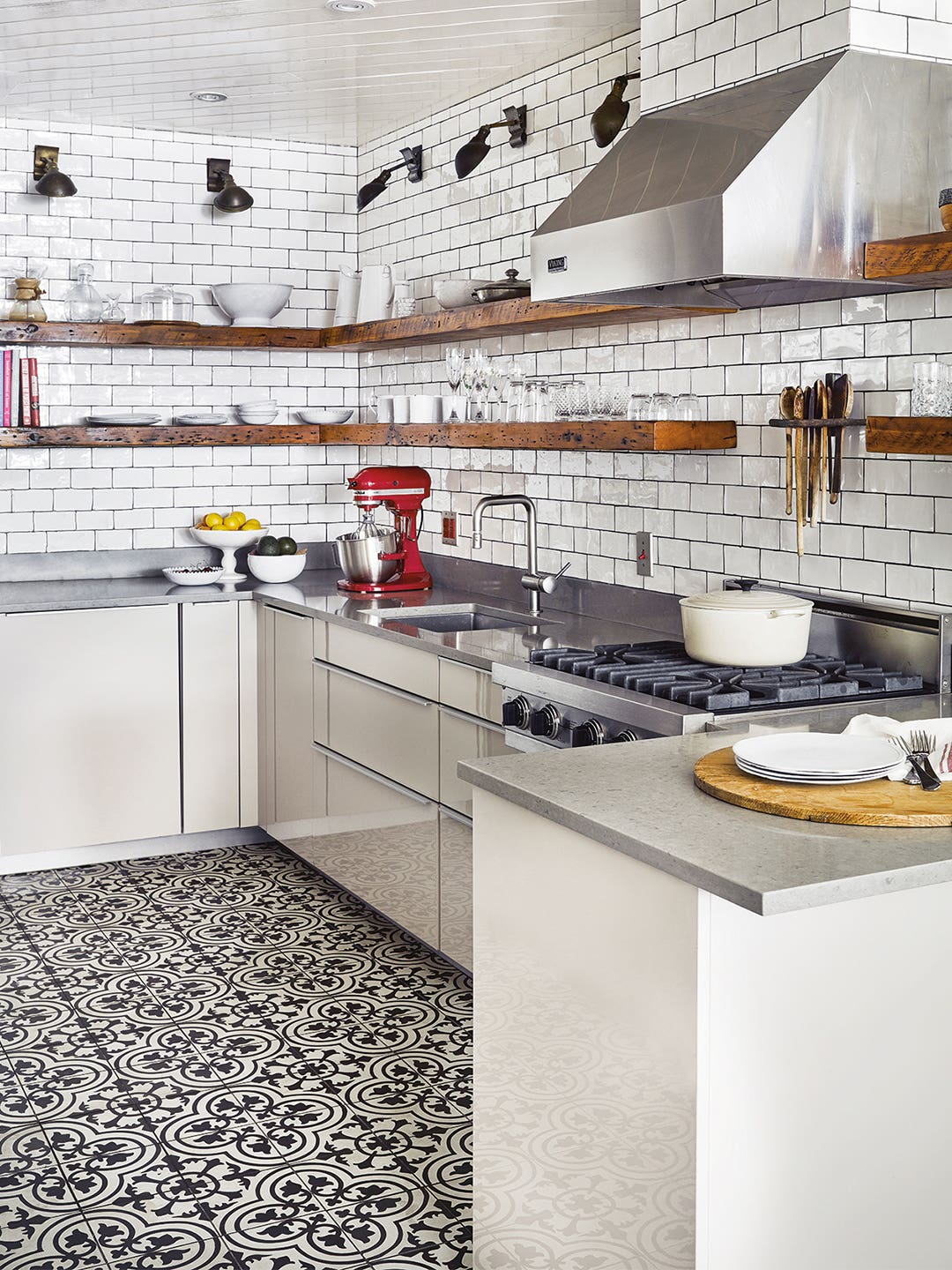 white kitchen with black and white tiles, open shelving