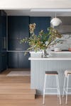 Kitchen with two-tone blue cabinets