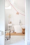 white bathroom with tan rug