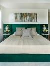 Bedroom with built-in green velvet headboard
