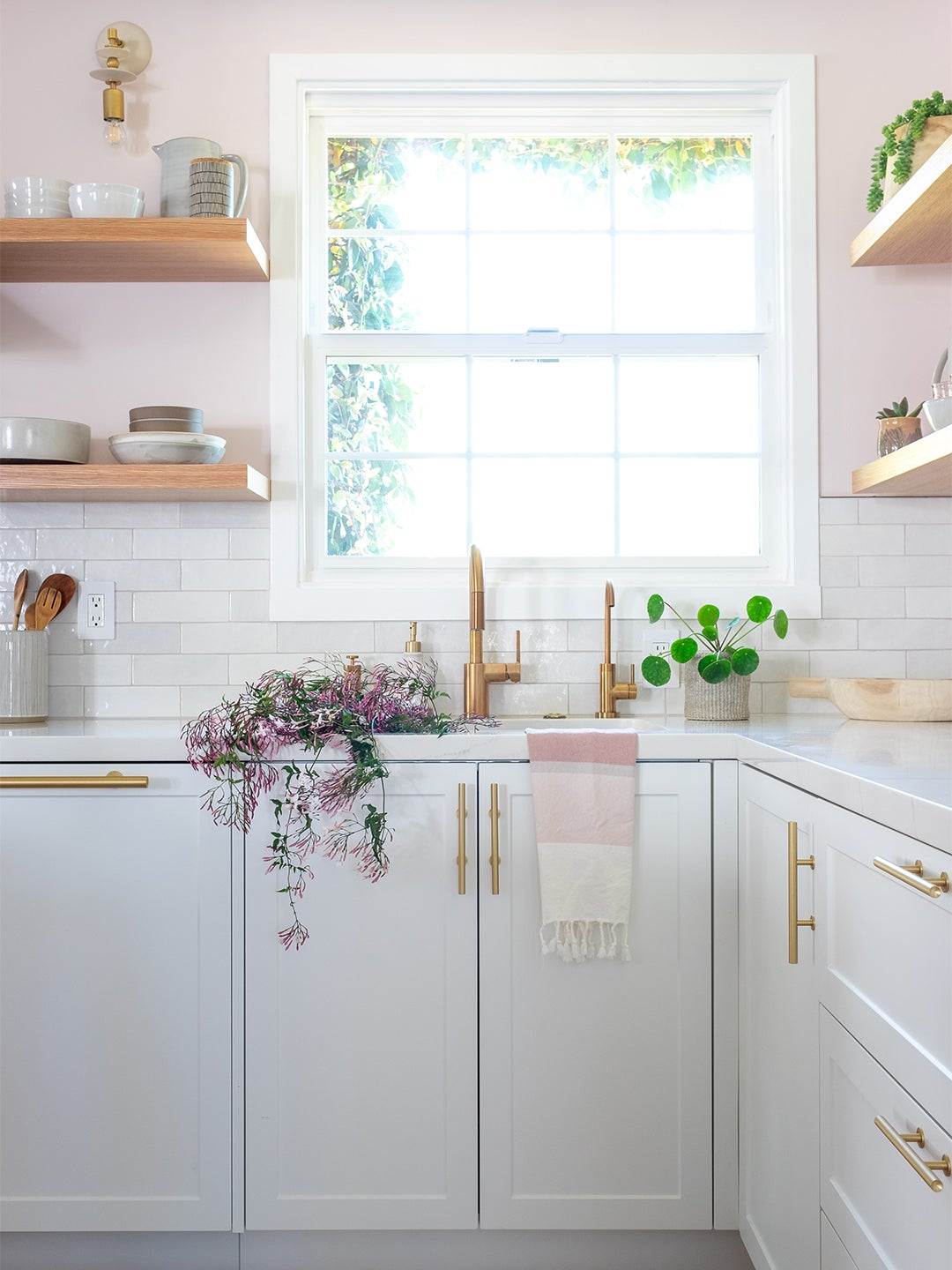 white and pink kitchen with open shelves