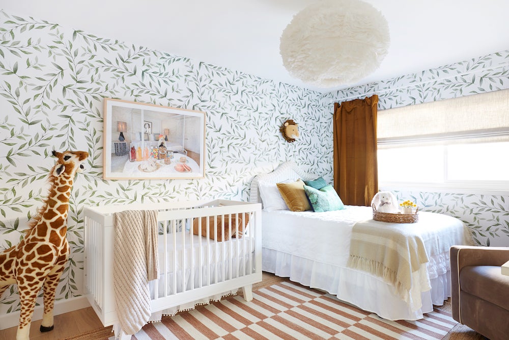 Amber Sokolowski Nursery with leafy wallpaper and gold velvet curtains