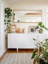 white credenza with photos on top