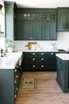 forest green kitchen cabinets marble counters