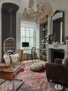 living room with rattan light fixture