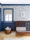 Nursery with blue and white wallpaper