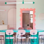 teal dining table and pink chairs