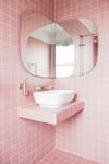 small pink-tiled bathroom