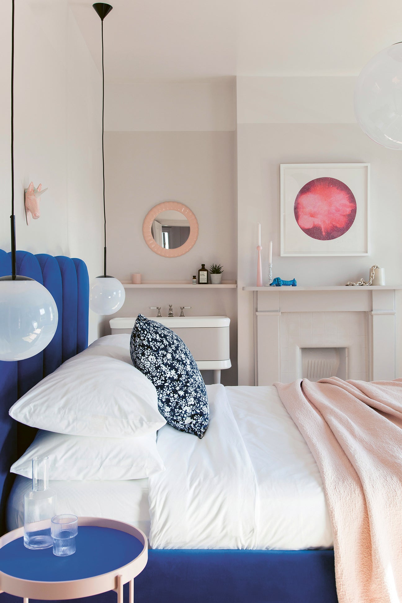 cobalt blue bed in pale pink bedroom