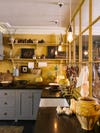 yellow kitchen with open shelving