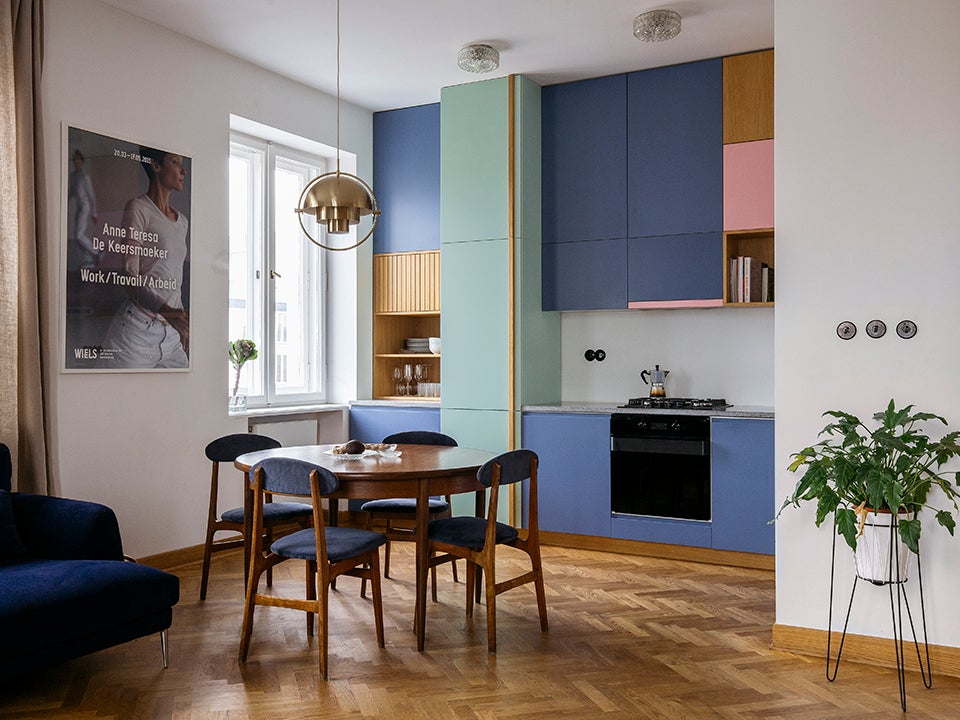color-blocked kitchen cabinets and dining table