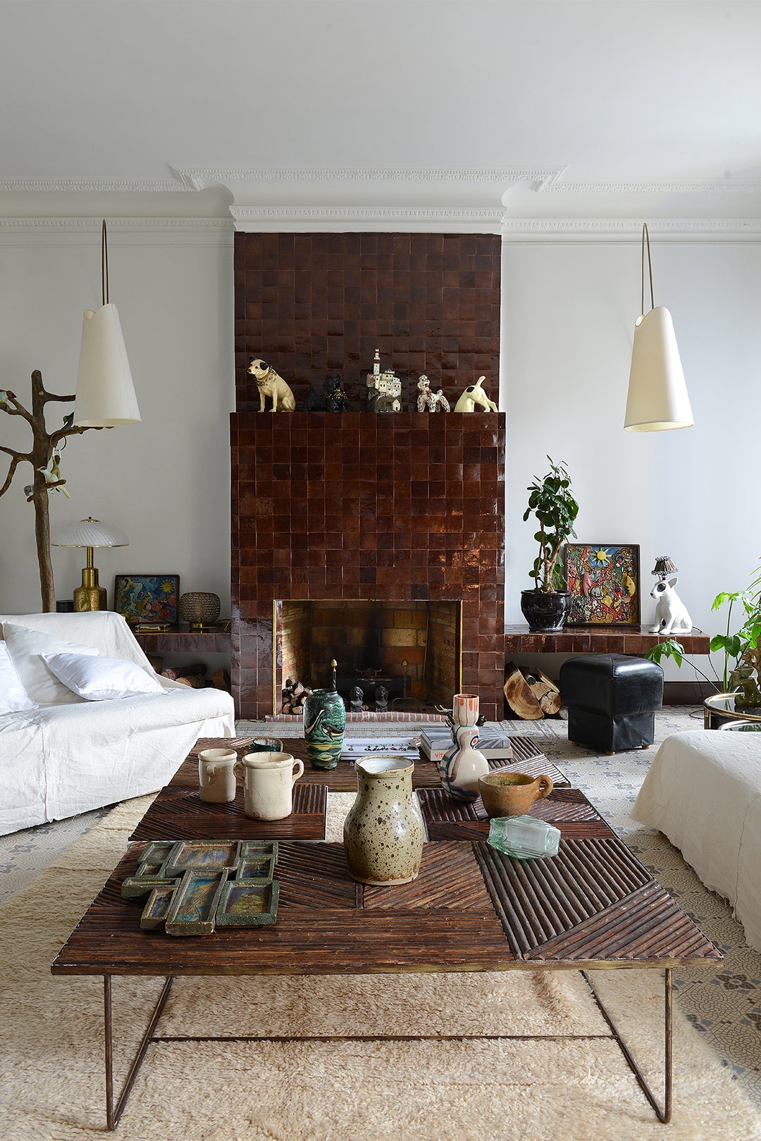 living room white sofas brown tile fireplace