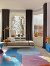 pastel colored living room with multicolored rug