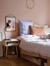 pink bedroom with pastel pillows