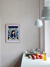 pale pink kitchen wall with blue pendant