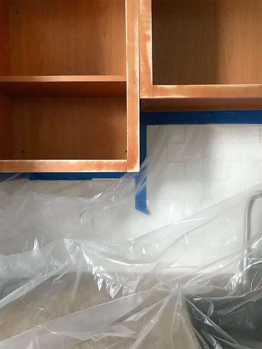 Cabinet frame with plastic drop cloth