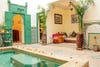 moroccan riad with seating nook and green doors