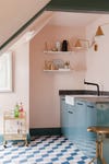 pink and blue kitchen with blue tile floor