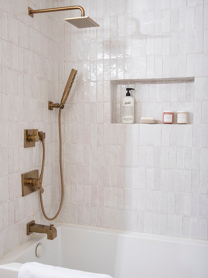 zellige tile shower with brassy faucet