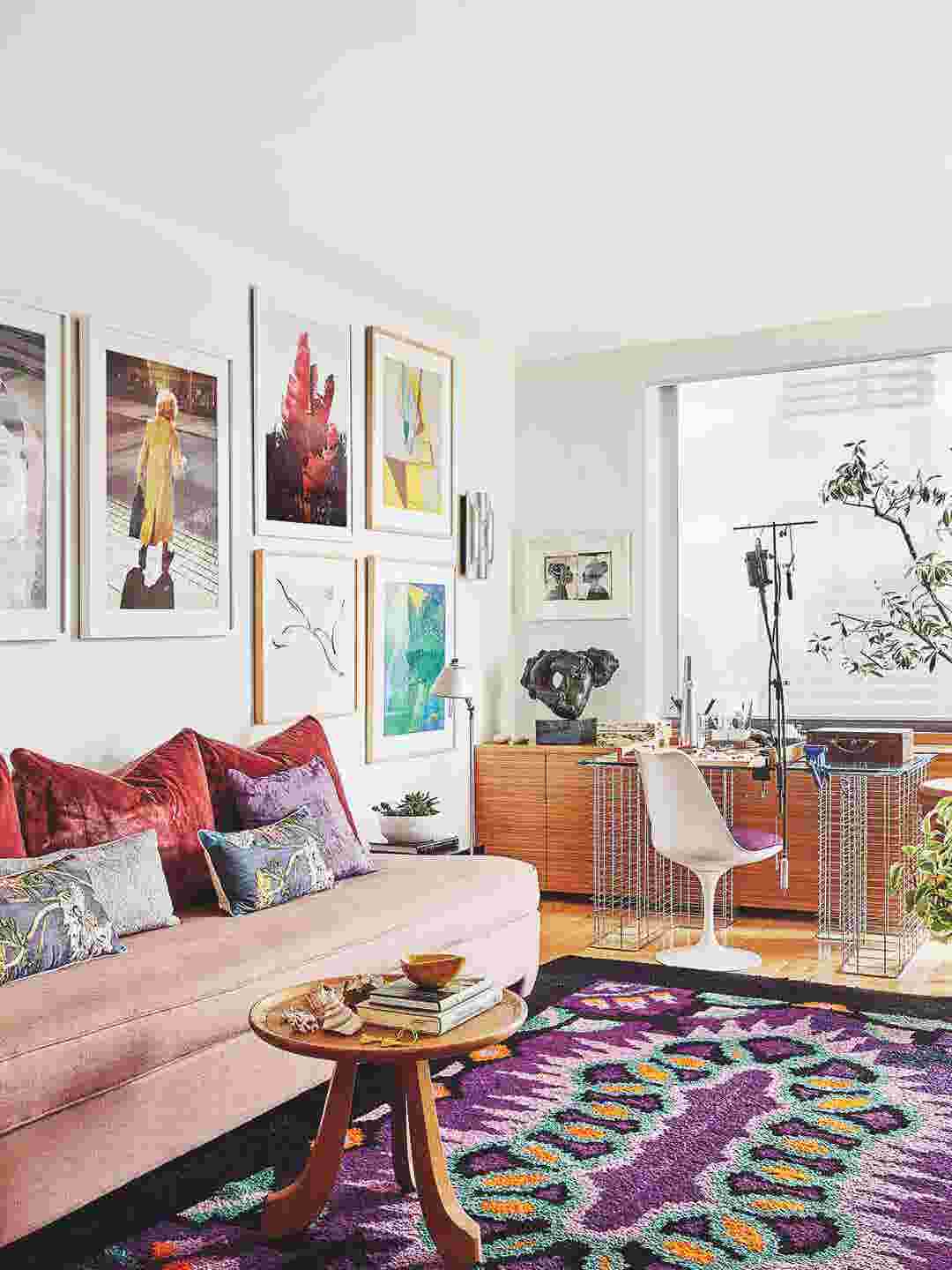 Living room with wall art and pink sofa
