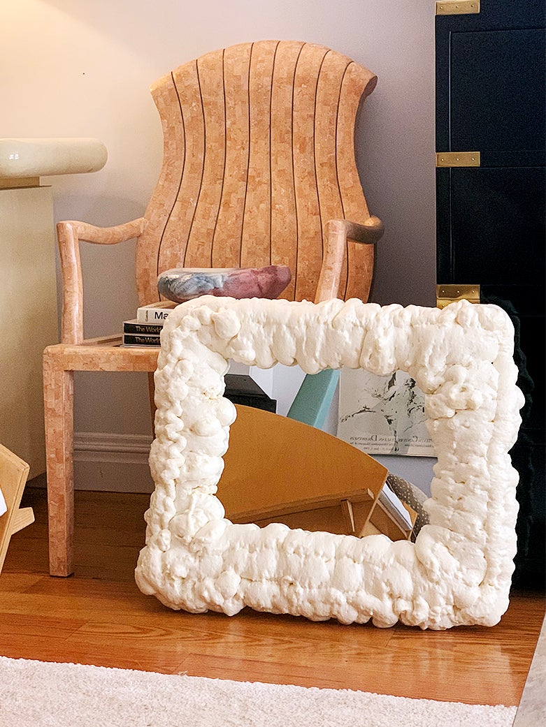 white foam mirror next to chair